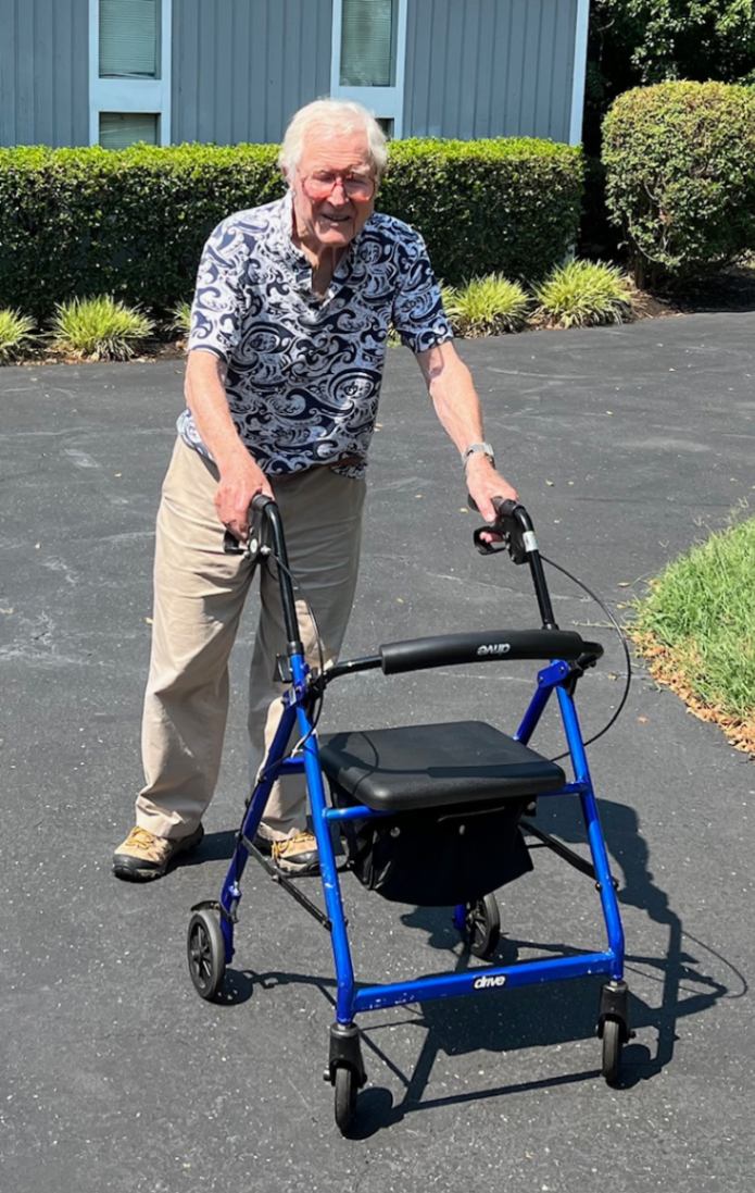 Former TRB Executive Director Thomas B. Deen with his rollator walker in driveway.