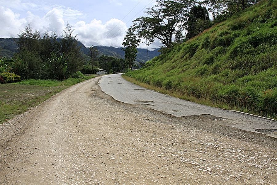 Paved low-volume road with worn surface